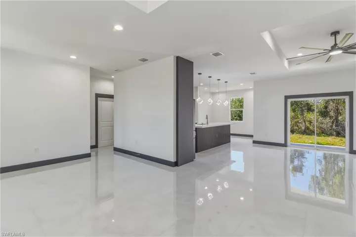 Spare room with ceiling fan and recessed lighting