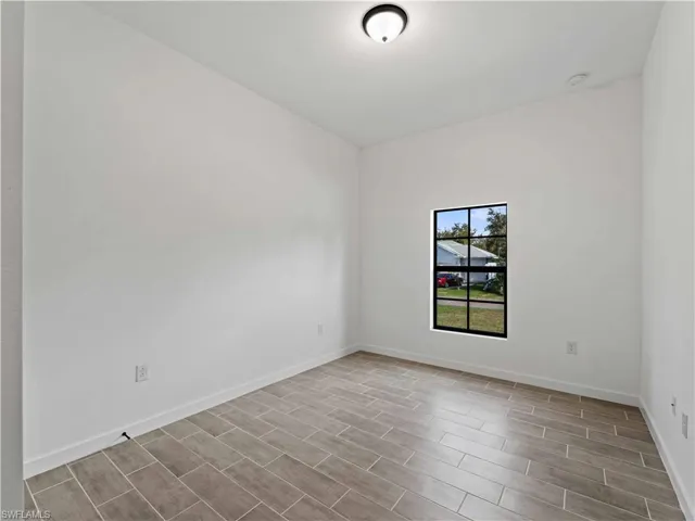 Empty room with light wood-type flooring