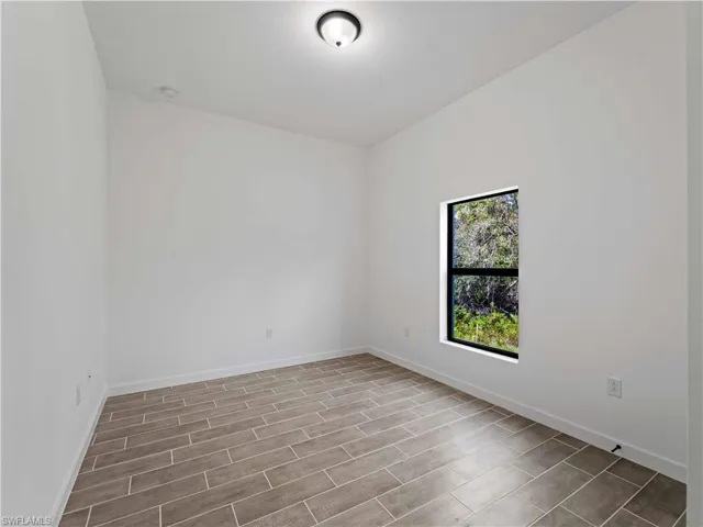 Spare room featuring light wood-type flooring