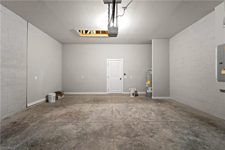 Garage featuring water heater