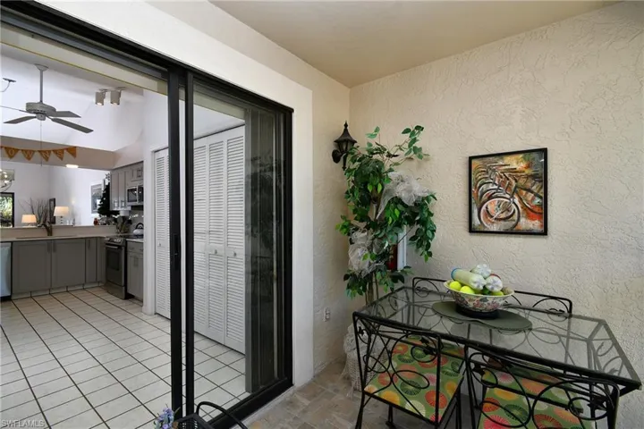 Dining space featuring a textured wall and ceiling fan
