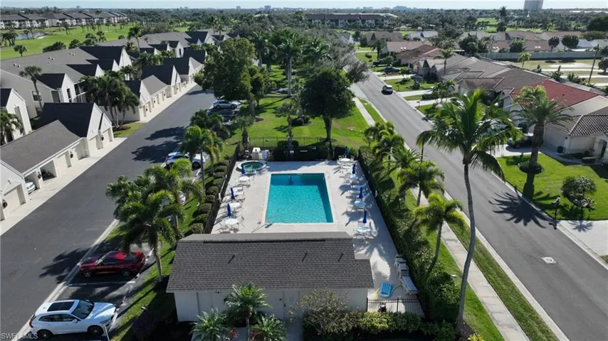 Aerial perspective of suburban area featuring a pool area