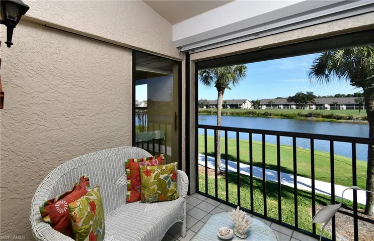 Balcony with a water view and a residential view