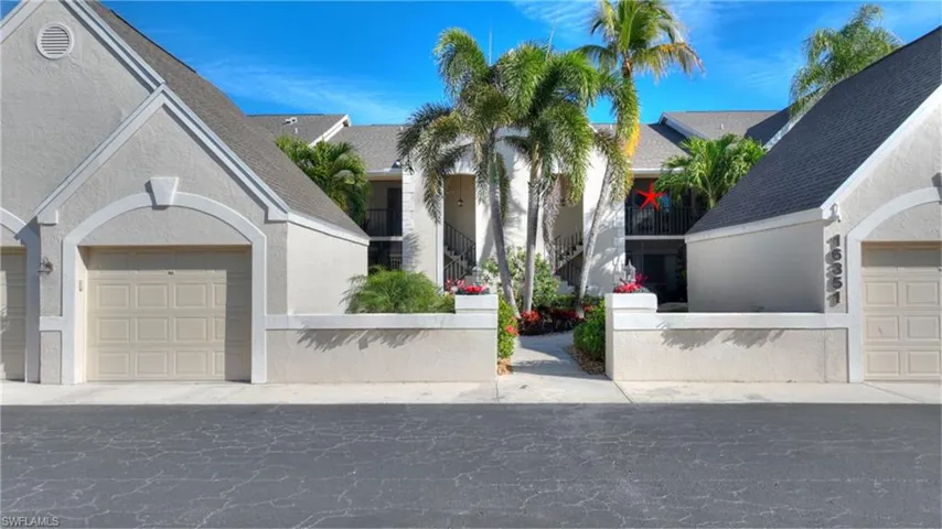 Single story home featuring stucco siding, roof with shingles, and a garage