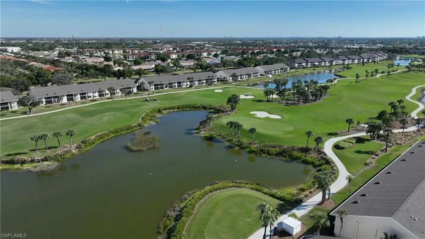 Aerial overview of property's location featuring a large body of water and nearby suburban area