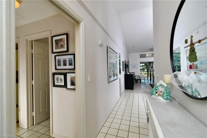 Hall with light tile patterned flooring