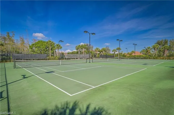 View of tennis court featuring community basketball court