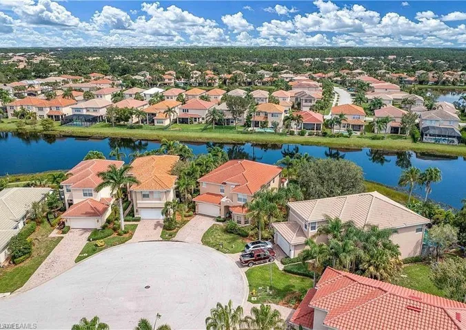 Aerial view of  Botanica Lakes residential area featuring a large body of water