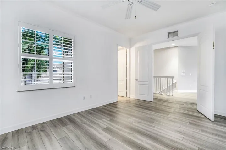 Unfurnished room featuring light wood-style flooring and a ceiling fan
