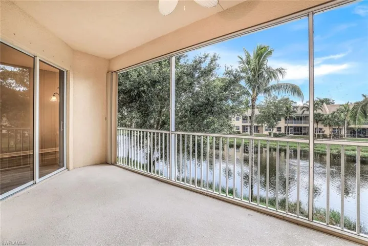 Unfurnished sunroom with a water view