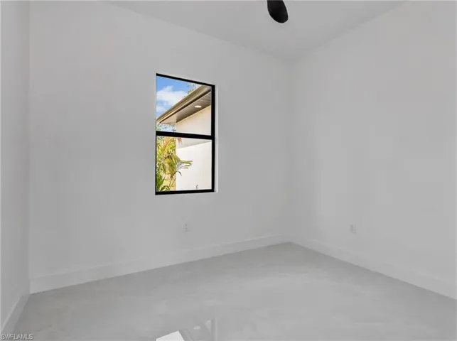 Unfurnished room with baseboards