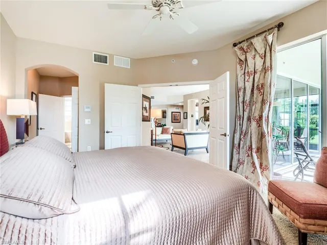Bedroom featuring ceiling fan and access to outside