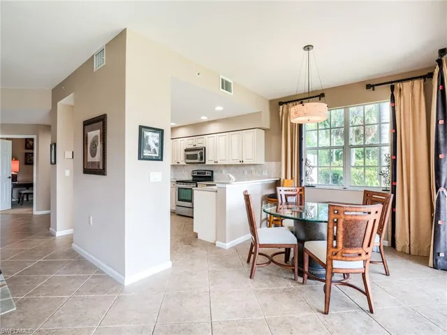 Dining room with light tile patterned floors