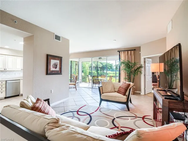 Living room with light tile patterned floors