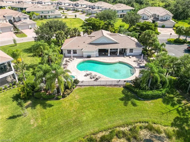 View of pool featuring a patio area and a yard