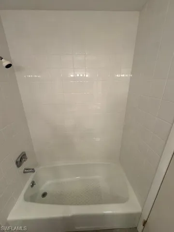 Full bath featuring  shower combination