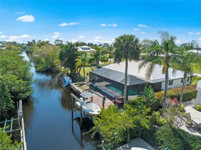 Aerial view of rear of home and canal