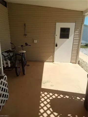 Shed & outside shower fixture under carport