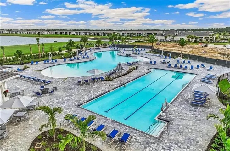 Community pool featuring a patio