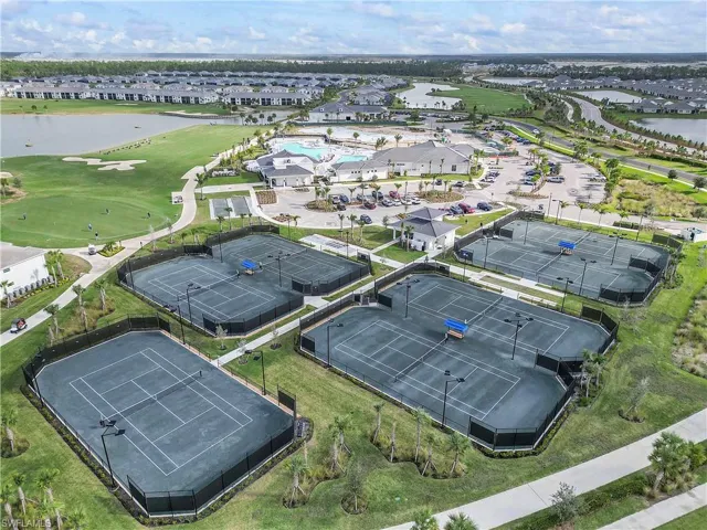 Drone / aerial view of a large body of water and a golf course