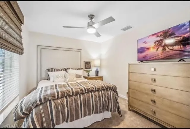 Bedroom with carpet flooring and ceiling fan