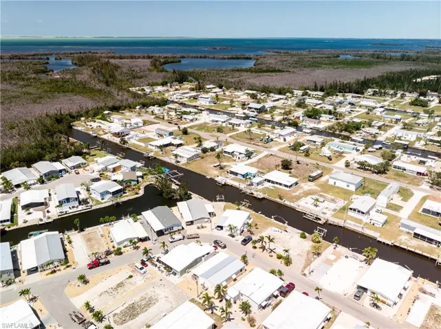 Aerial view featuring a water view and a residential view