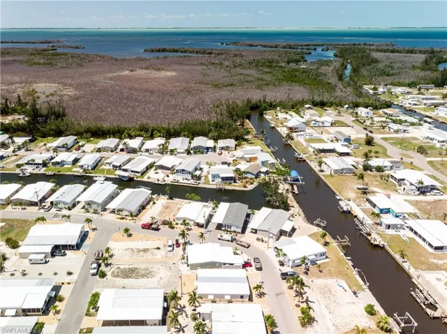 Aerial view with a residential view and a water view