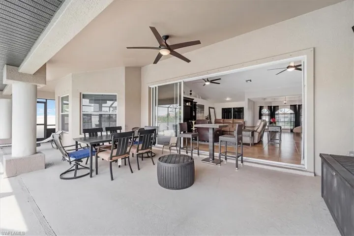 View of patio featuring a ceiling fan and outdoor dining space