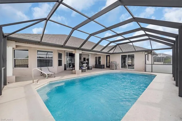 Pool featuring a patio area, a lanai, and area for grilling
