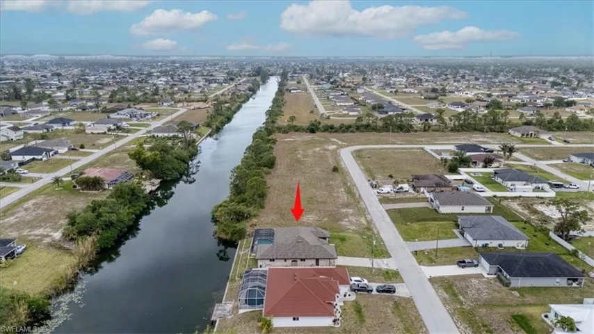 Drone / aerial view featuring a water view and a residential view