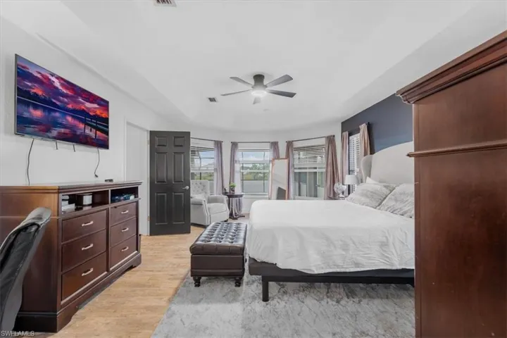 Bedroom with light wood-type flooring and ceiling fan