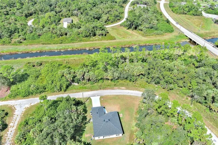Aerial overview of property's location featuring a nearby body of water