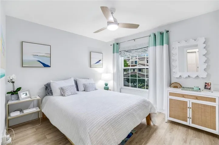 Bedroom featuring light wood-style flooring and a ceiling fan