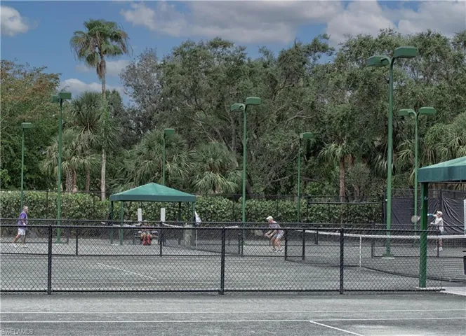 View of tennis court with fence