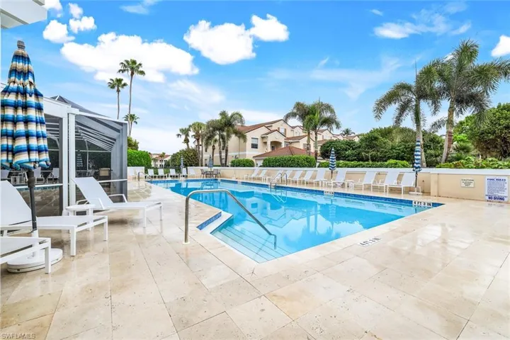Community pool with a lanai and a patio area
