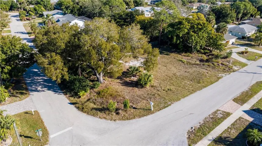 Aerial perspective of suburban area with a tree filled landscape