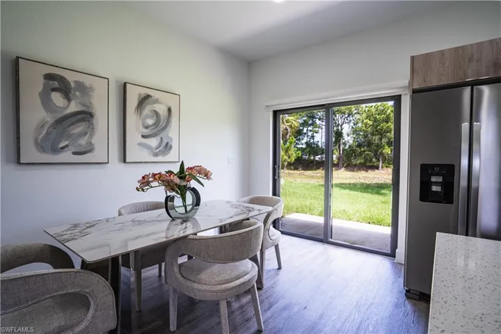 Dining area with light wood-type flooring