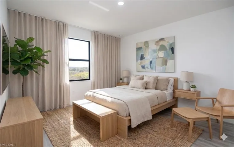 Bedroom with light wood-type flooring  **photo has been virtually staged