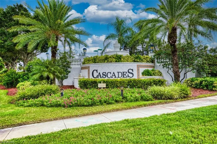 Community / neighborhood sign featuring a yard