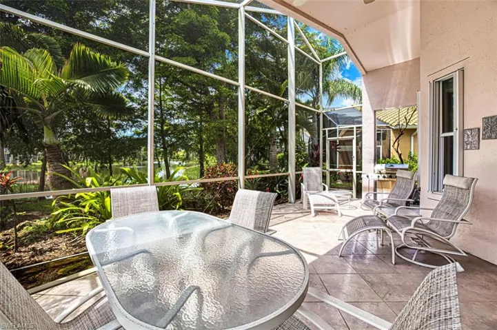 Sunroom / solarium with a patio and outdoor dining space