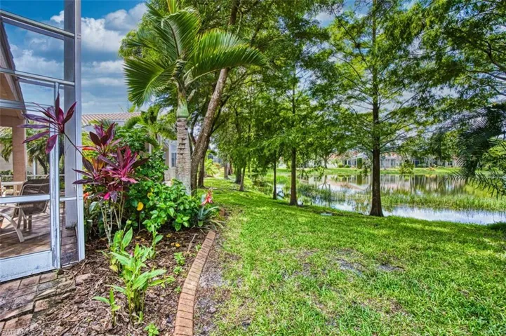 View of green lawn with a water view