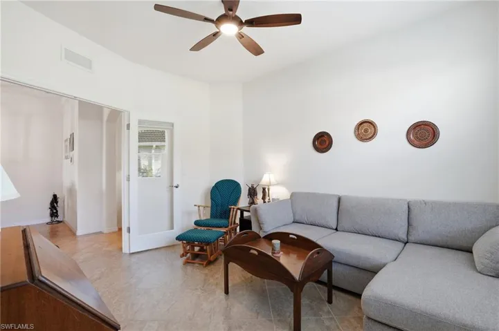 Living room featuring a ceiling fan