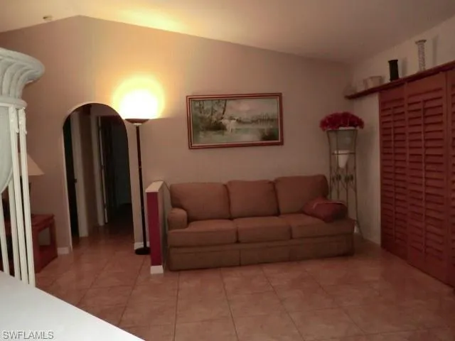 Vaulted ceiling with an arched doorway, providing an open atmosphere