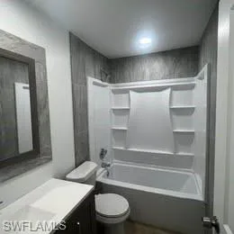 Full bath with vanity and shower / tub combination