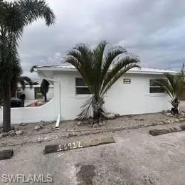 View of side of home with stucco siding