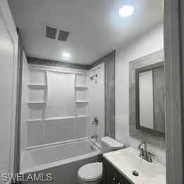 Full bathroom with vanity and shower / tub combination