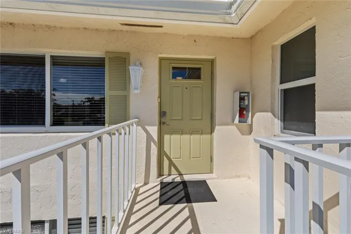 Doorway to property featuring a balcony