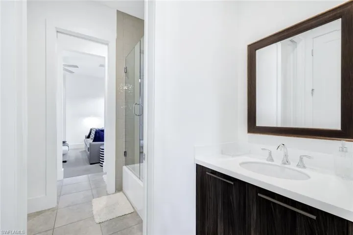 Guest bath with two vanities, shower and tub.