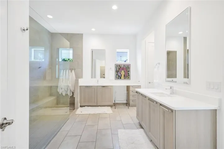 Primary oversized bath with 2 HUGE walk in closets.