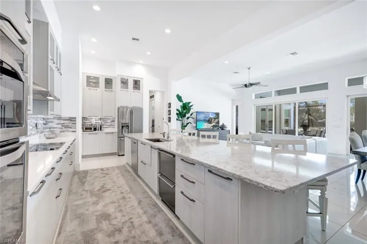 Upscale appliances, 15 ft quartz island, refrigerator with built in Keurig. Lake views.